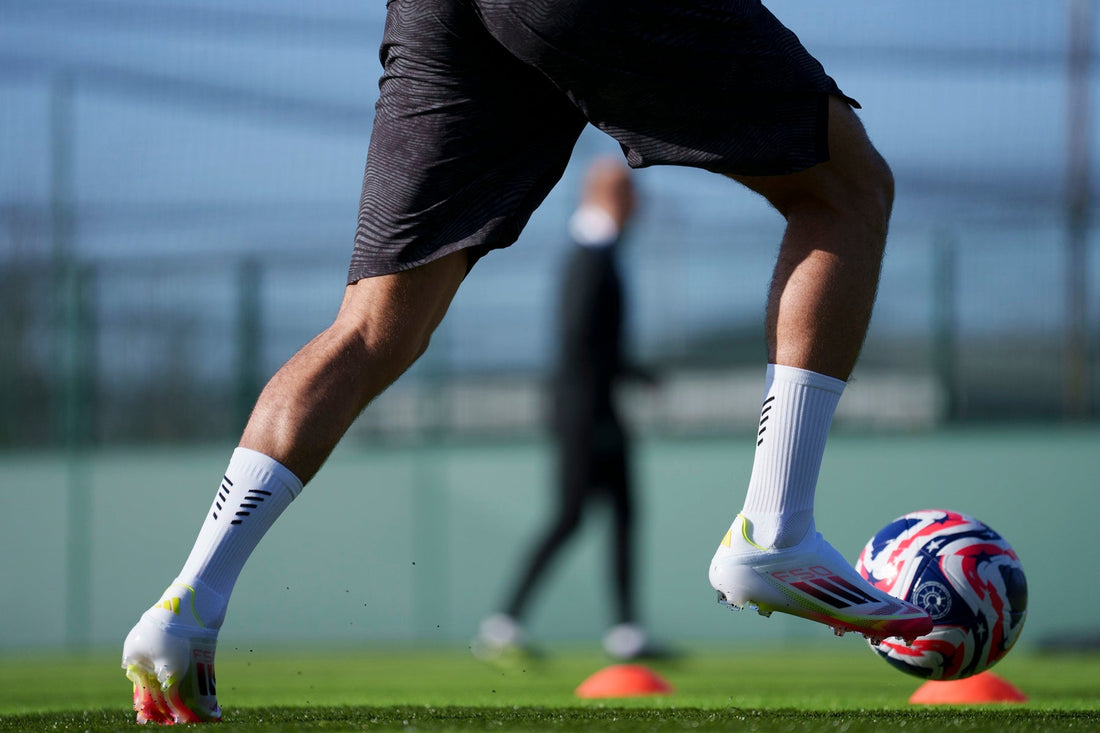 Why Are Footballers Cutting Holes in Their Socks?