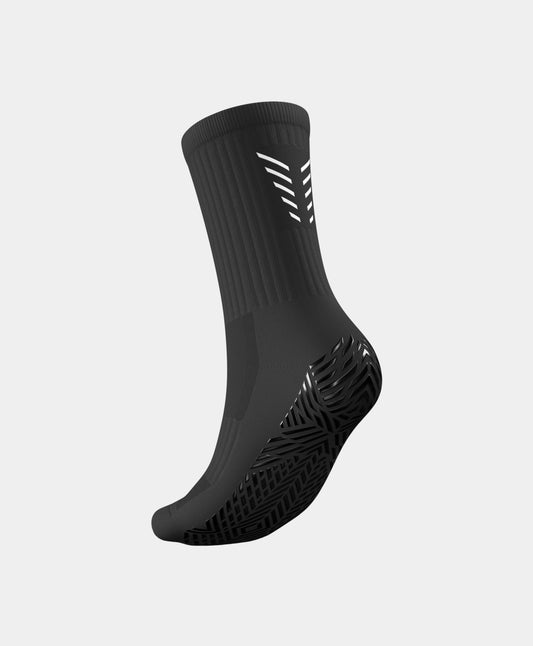 Player wearing Icon Mid-Calf Football Grip Socks demonstrating agility and speed on the pitch.