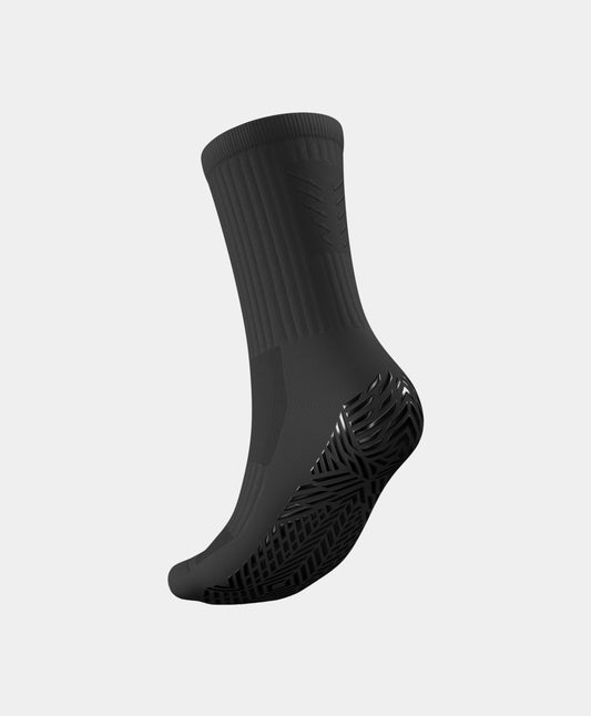 Professional athletes using Stealth Mid-Calf Football Grip Socks on the pitch, demonstrating superior grip and comfort.
